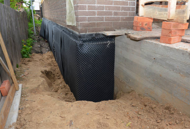 SJ Waterproofing Pros technician performing targeted Waterproofing assessment in Elba, AL